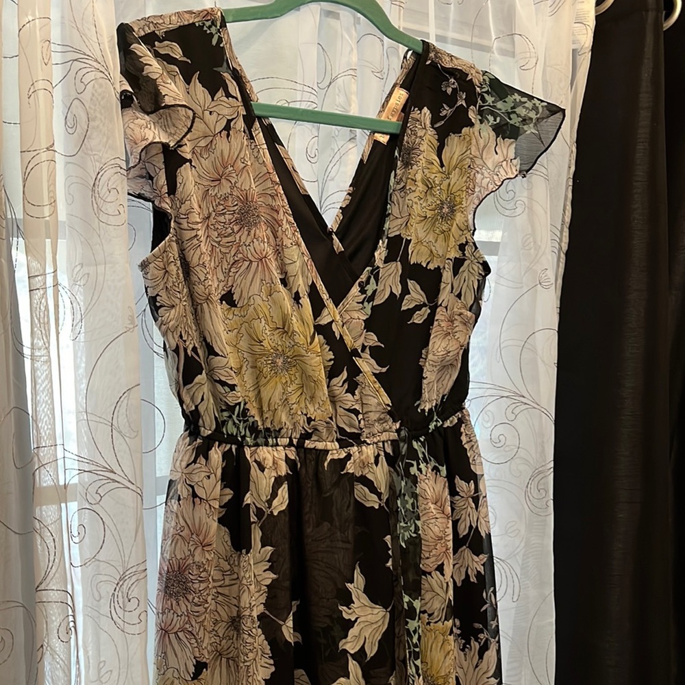 Black dress with floral print and flowy skirt